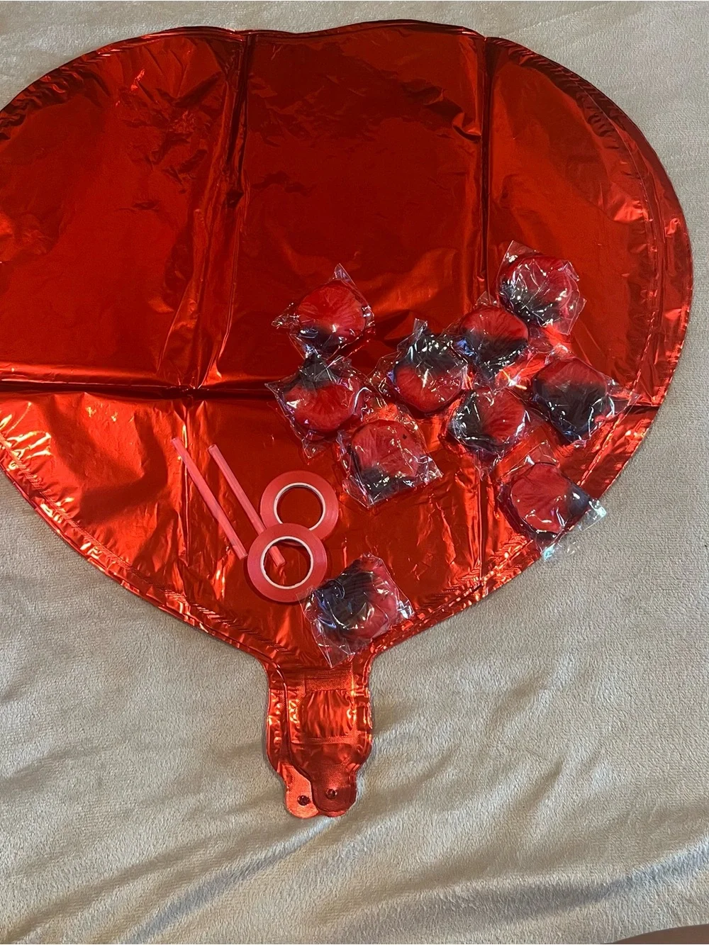 Love and Heart-Shaped Aluminum Foil Balloons, ribbon and rose petals